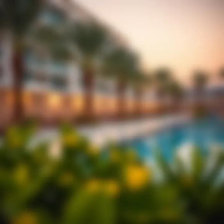 Outdoor pool area with sun loungers at Staybridge Al Maktoum.