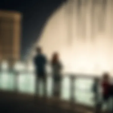 Visitors enjoying the fountain show from a nearby promenade