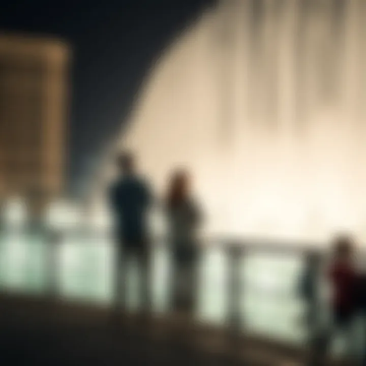 Visitors enjoying the fountain show from a nearby promenade